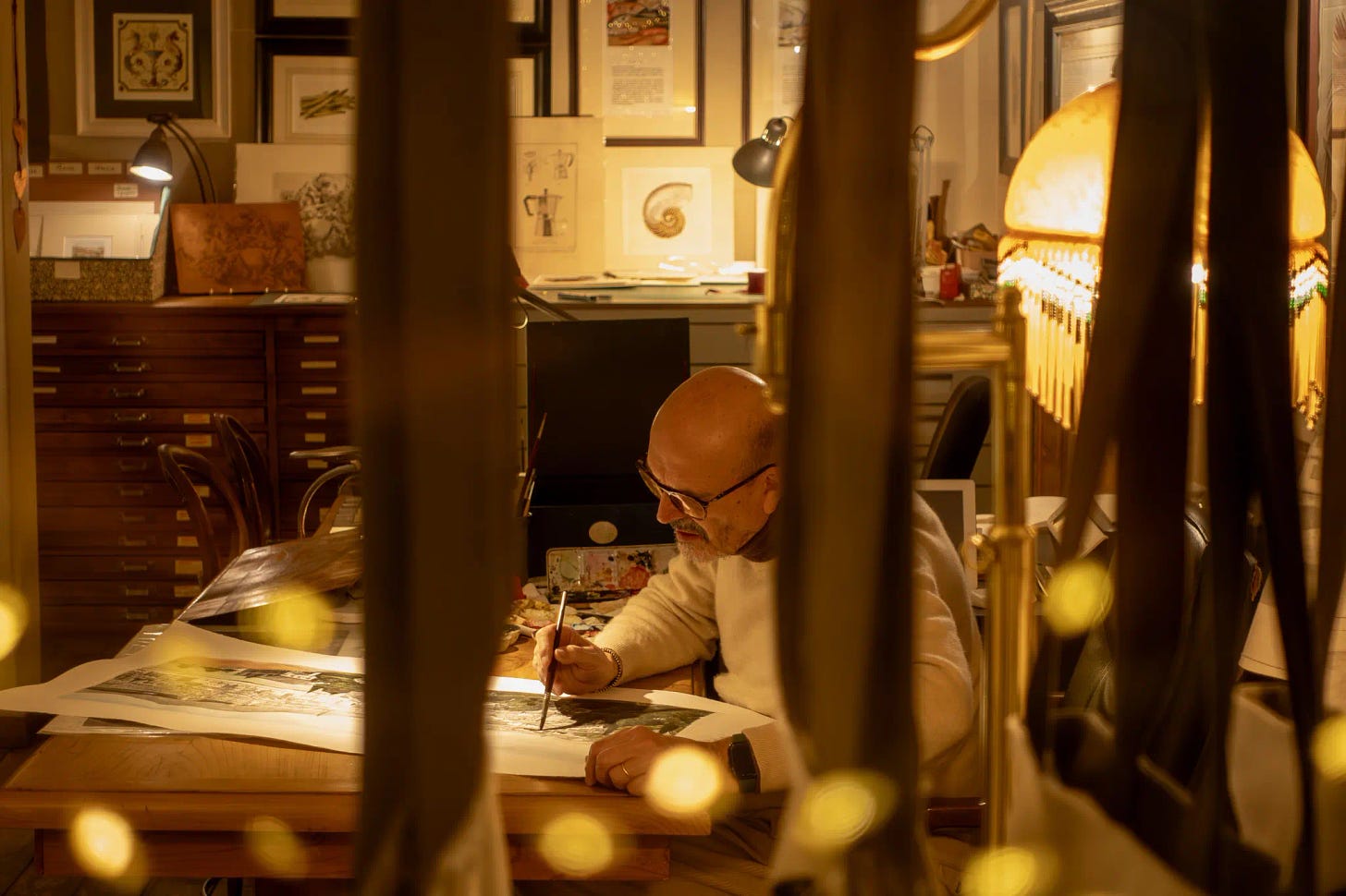 An artist sketching in his studio in Florence, Italy