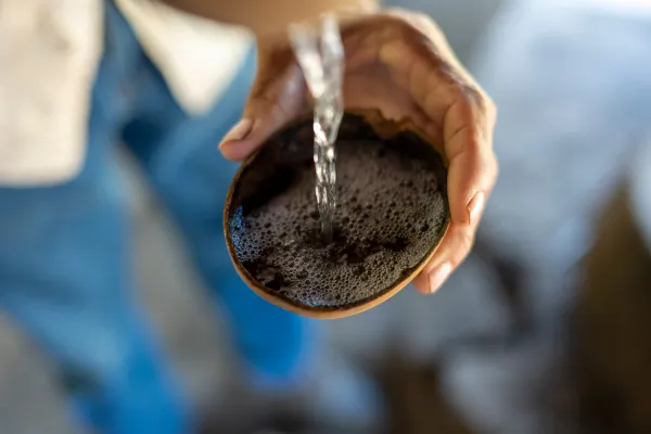 Raiciilero Don Lupe pouring raicilla