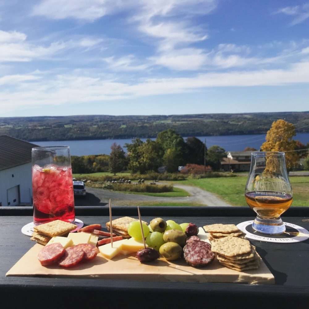 A small bite and drink from Finger Lakes Distillery looking over Seneca Lake.